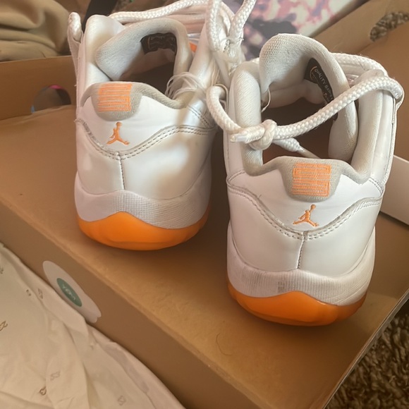 These are Jordan 11s low top. Orange and white. They need a good washing. - Picture 5 of 6